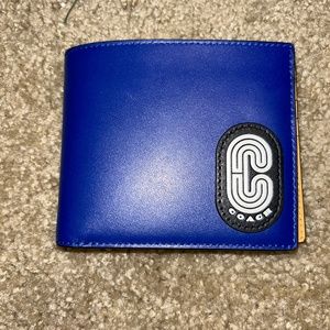 Mens brand new blue and yellow coach wallet